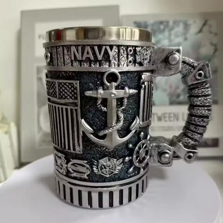 Decorative mug with navy-themed design on a white surface